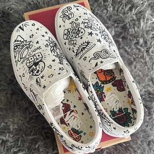 Vans White Slip-On Shoes with Black Graphic Design